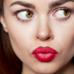 Portrait of woman close-up look aside red lips
