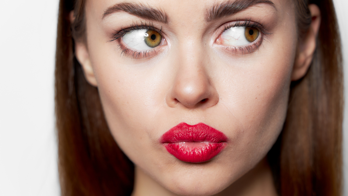 Portrait of woman close-up look aside red lips