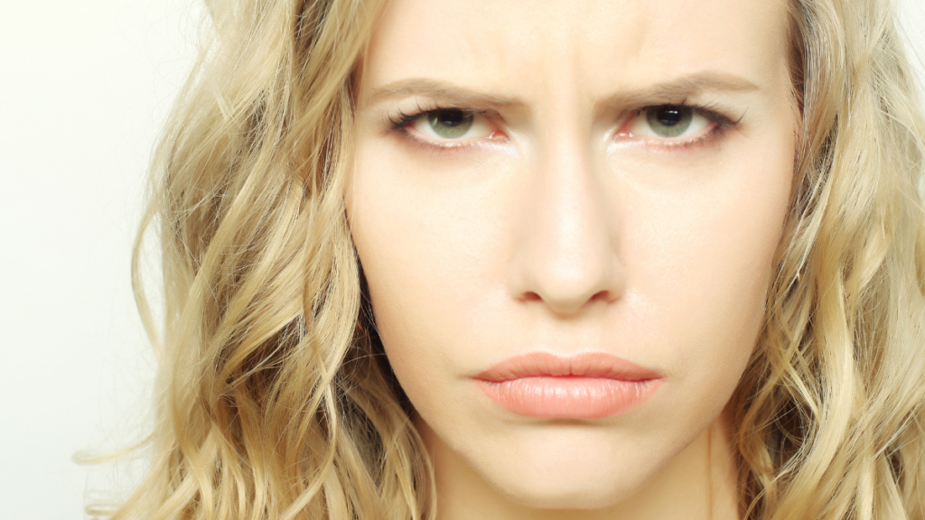Portrait of dissatisfied young woman.