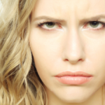 Portrait of dissatisfied young woman.