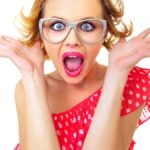Funny surprised pin-up girl, isolated on white. Freak out woman.