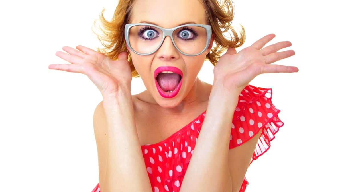 Funny surprised pin-up girl, isolated on white. Freak out woman.