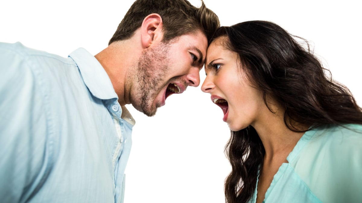 Couple screaming and arguing on white screen.
