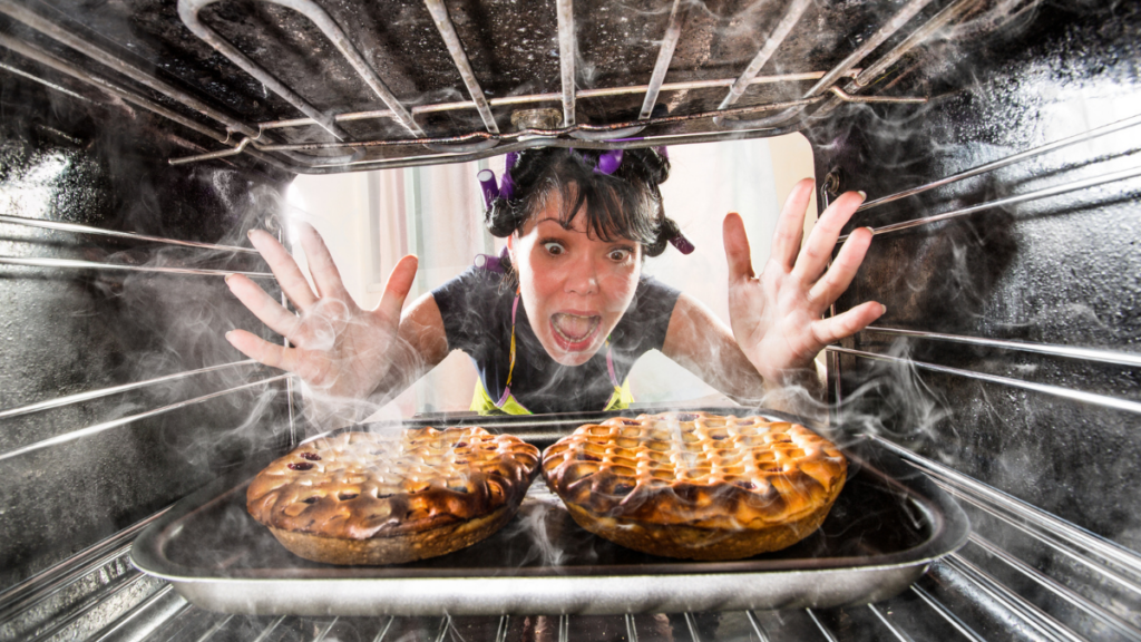Funny chef perplexed and angry because stuff is burning food.