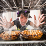 Funny chef perplexed and angry because stuff is burning food.