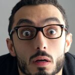 Man with a surprised facial expression, Surprise expression.
