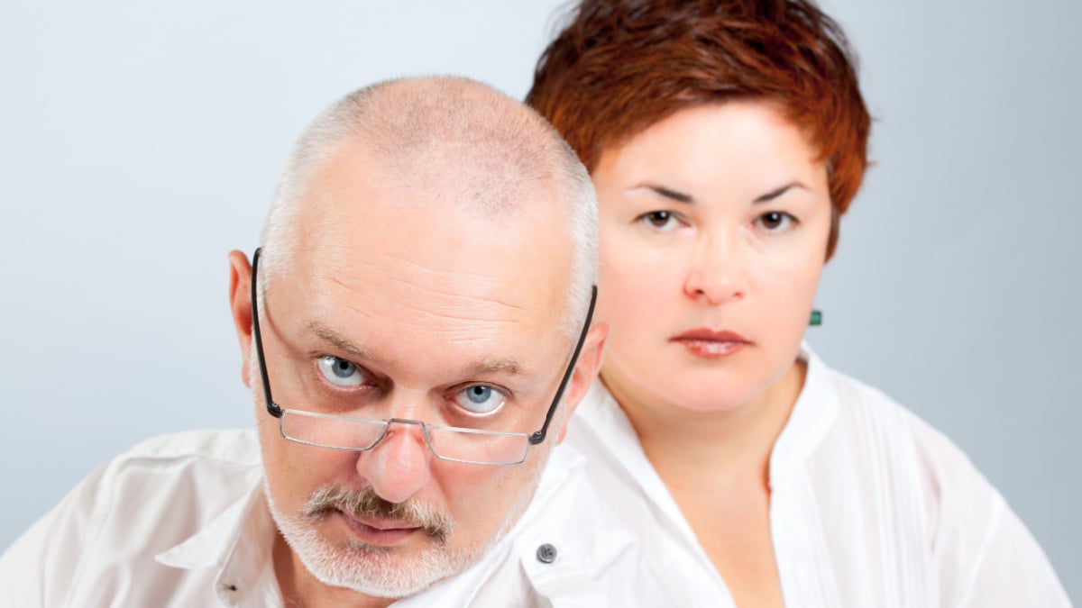Serious parents expressing their concern and worry/ Worried parents.