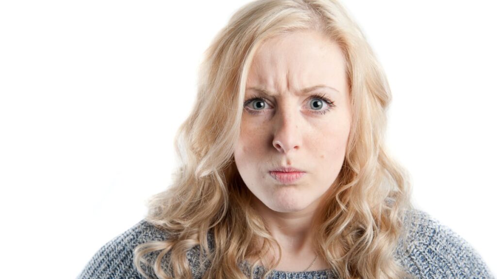 Woman not looking very happy about something.