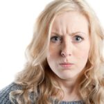 Woman not looking very happy about something.