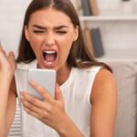Furious Lady Shouting On Smartphone.