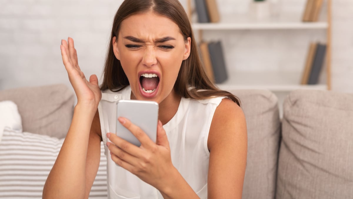 Furious Lady Shouting On Smartphone.