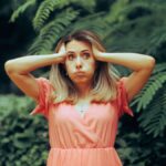 Stressed Woman Feeling Exasperated at Garden party.