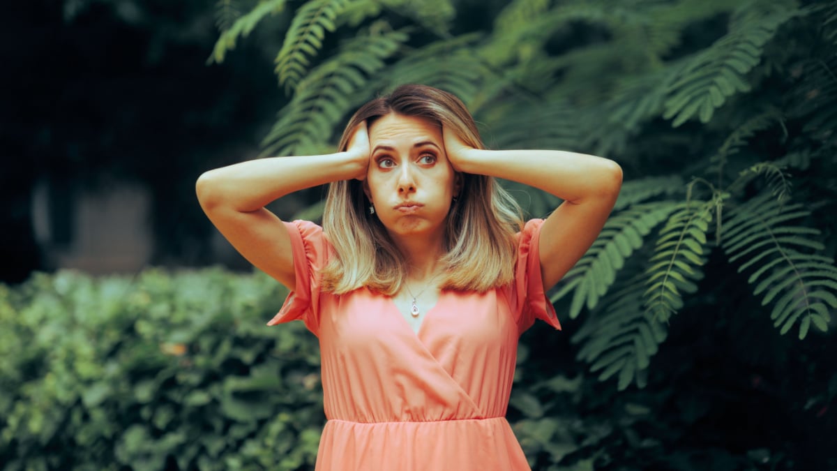 Stressed Woman Feeling Exasperated at Garden party.