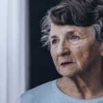 Elderly woman with memory problem spending time in nursing home.